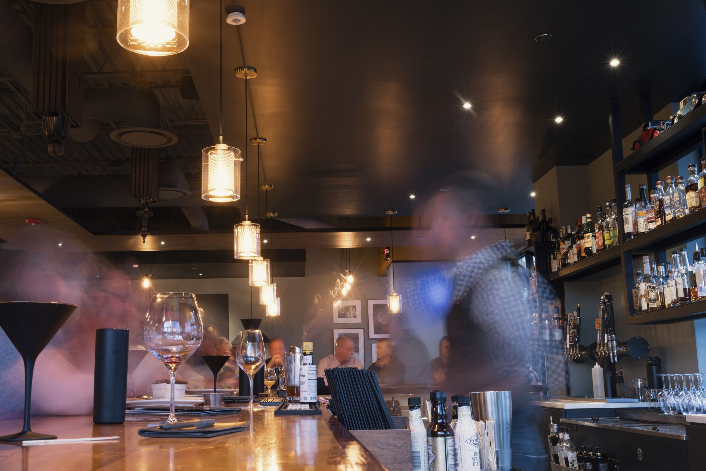The bar at Domenic’s with its lit back-bar shelves