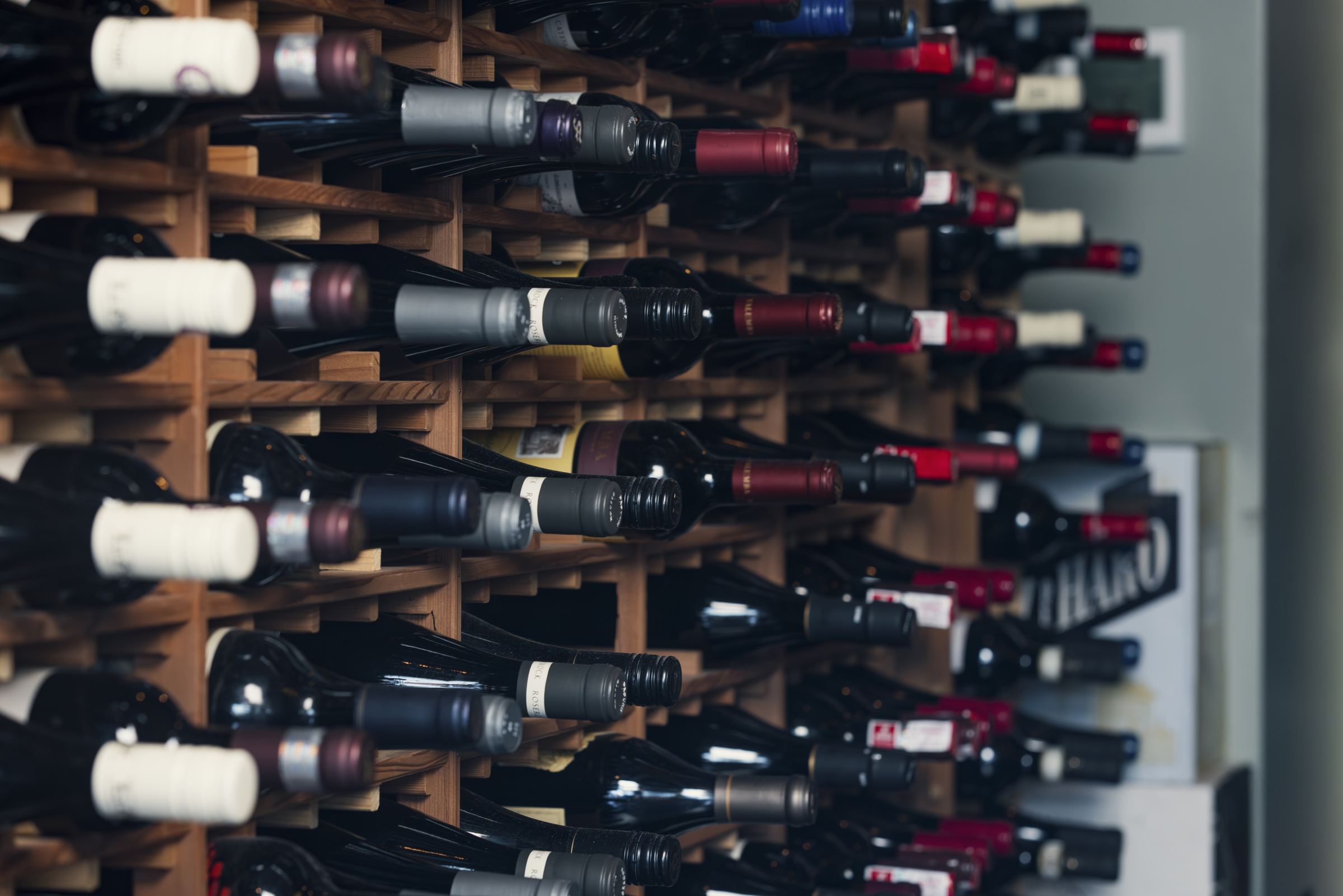Rows of wine bottles in the Domenic’s wine wall